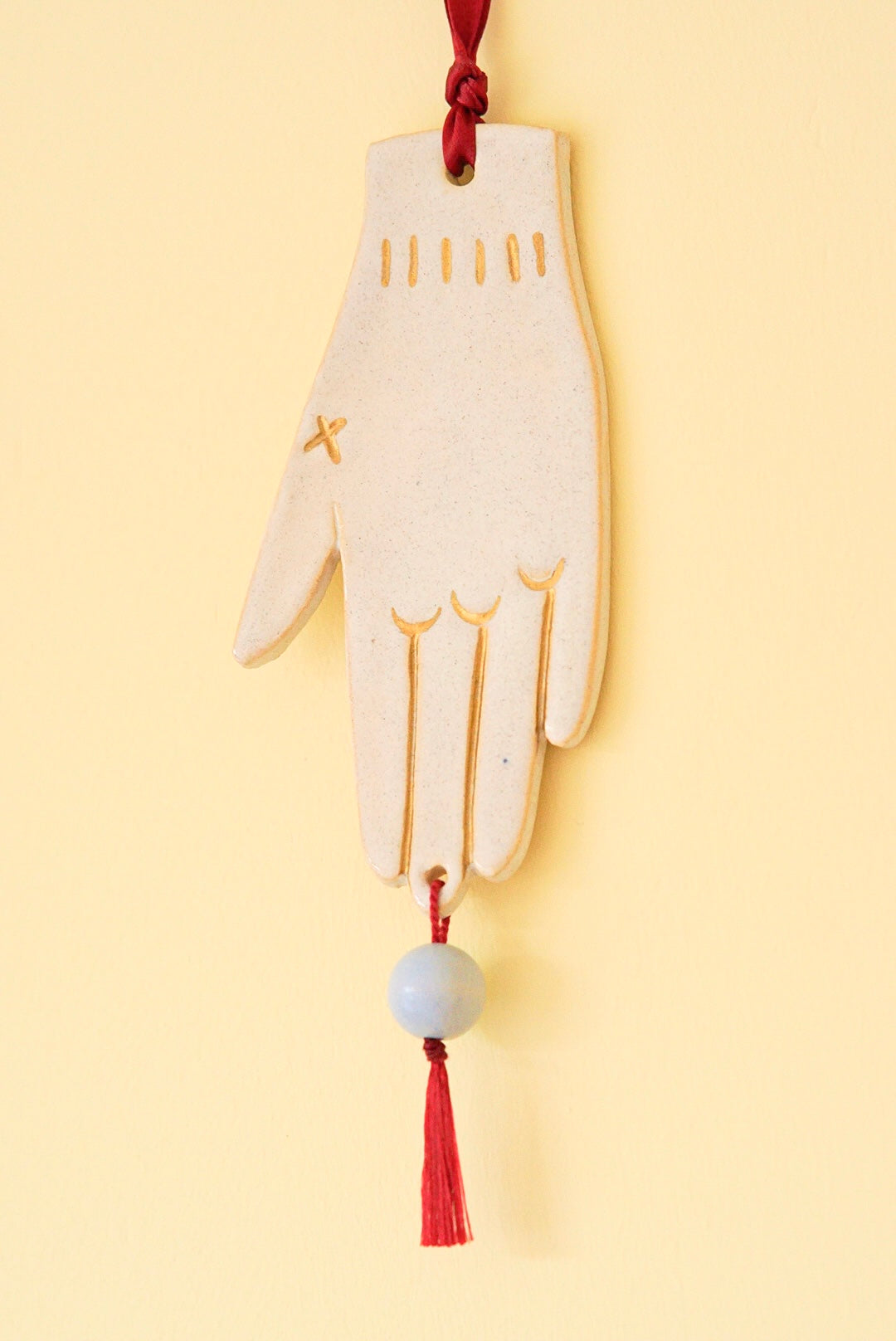 Festlicher Wandschmuck - Hand (blaue Perle)